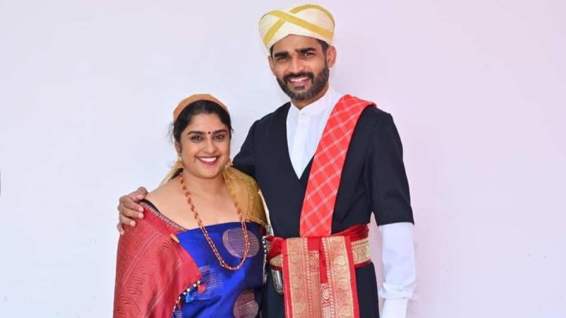 Couple in traditional Kodava attire. Credits: Manshi Devaiah Couple in traditional Kodava attire.